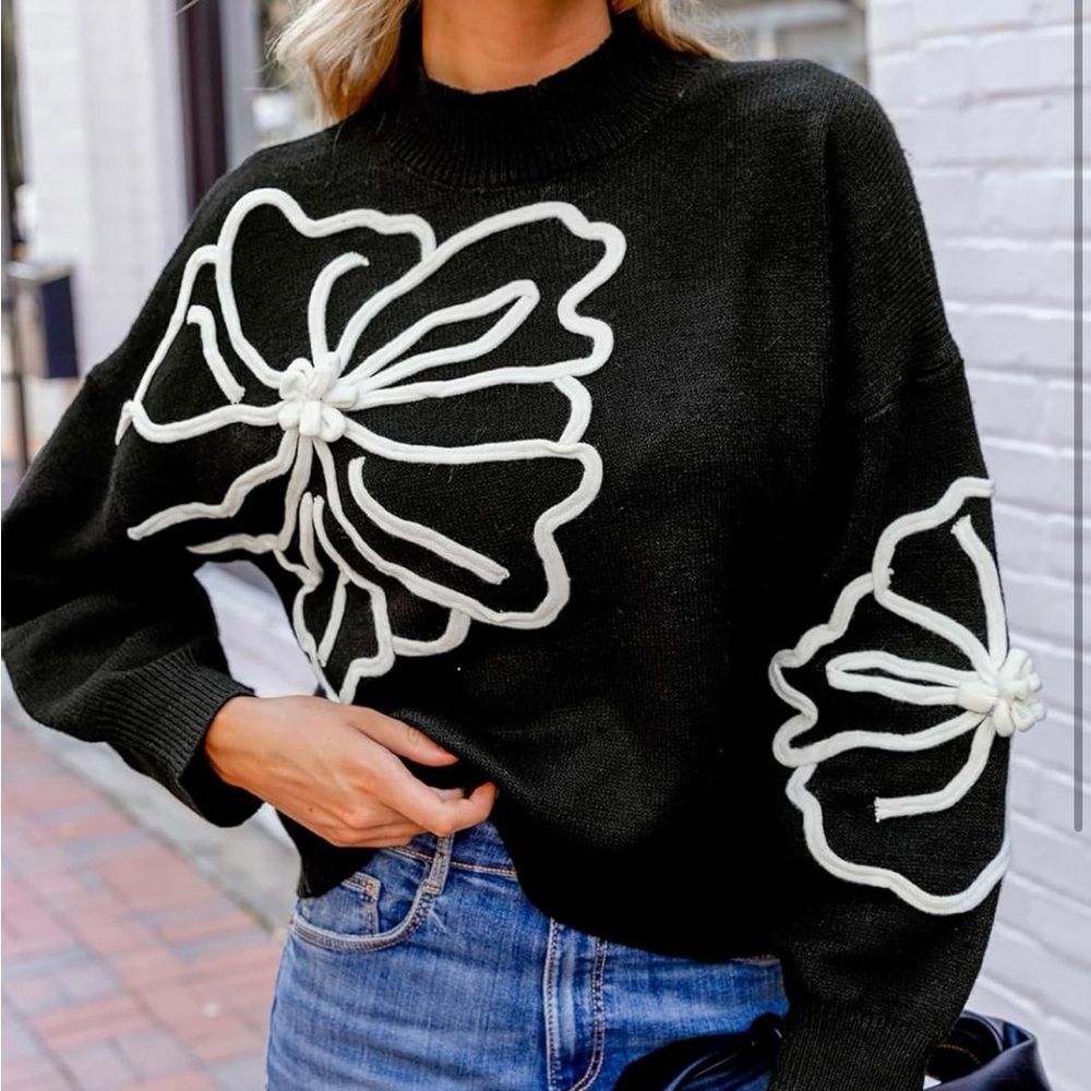 Chic Black Sweater with White Floral Design small